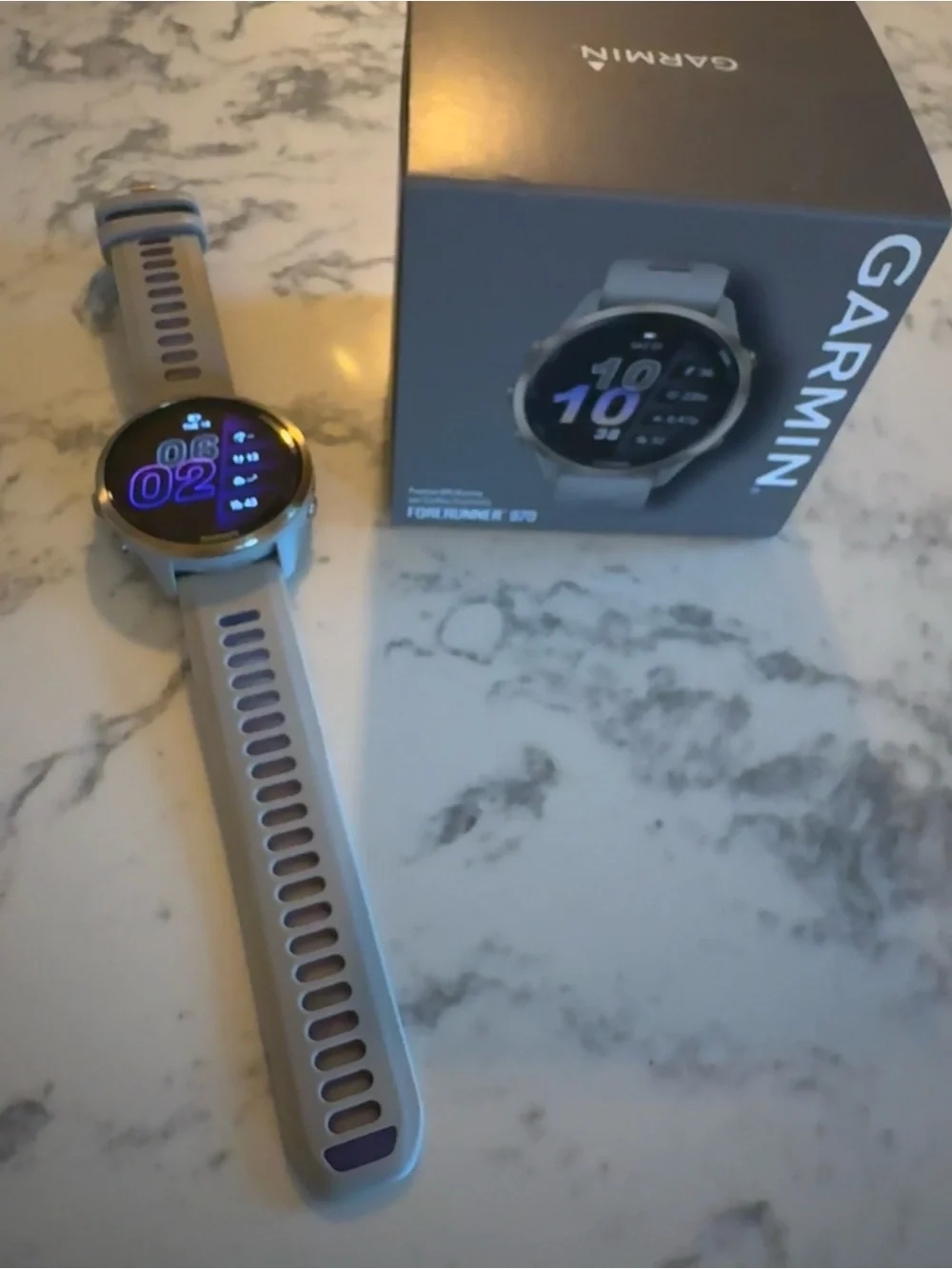 garmin Forerunner 970 Smartwatch - Soft Gold Titanium with French Gray Case